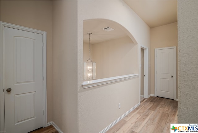 corridor featuring light hardwood / wood-style flooring