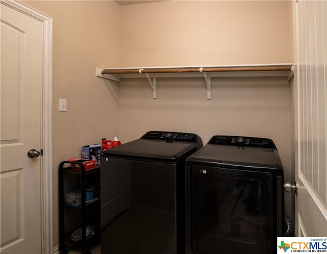 clothes washing area with independent washer and dryer