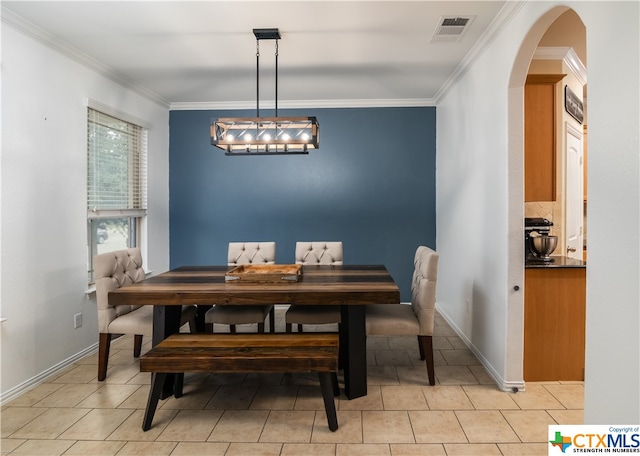 tiled dining space with ornamental molding