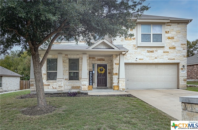 view of front facade with a front yard and a garage