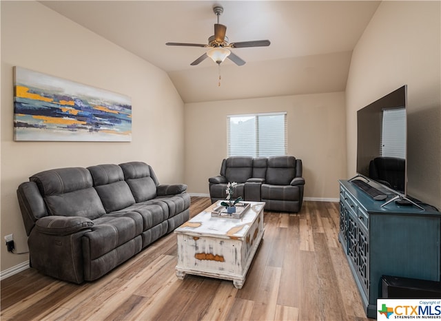 living room with vaulted ceiling, ceiling fan, and wood-type flooring