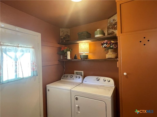 laundry area featuring washer and clothes dryer and laundry area