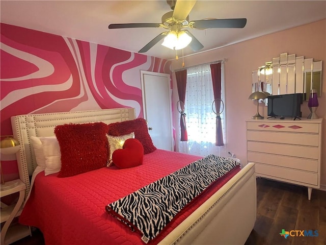 bedroom featuring a ceiling fan and wood finished floors