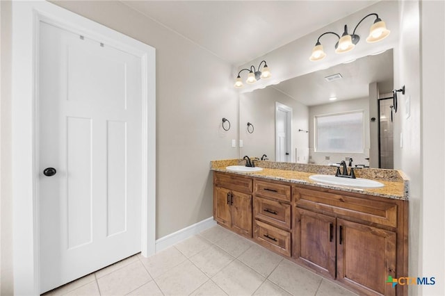 full bathroom with tile patterned floors, a sink, and double vanity