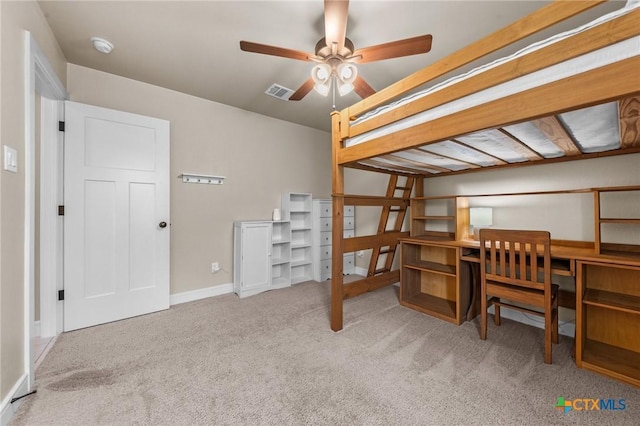 bedroom with carpet floors, visible vents, and baseboards