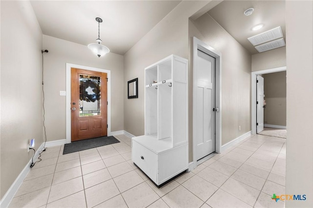 entrance foyer featuring light tile patterned flooring, visible vents, and baseboards