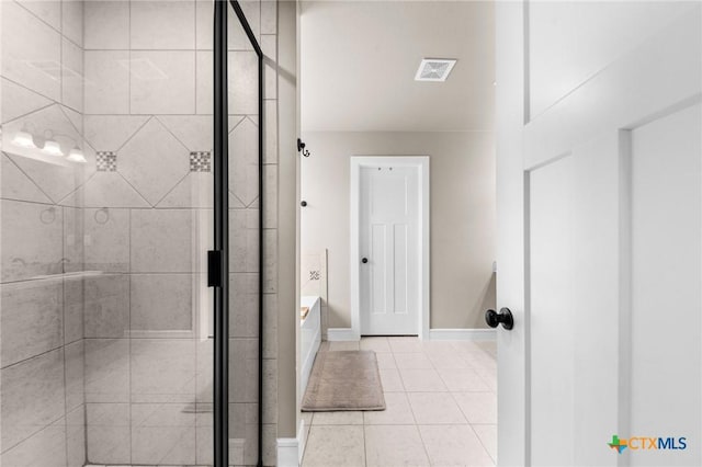full bathroom featuring a shower stall, a garden tub, baseboards, tile patterned flooring, and visible vents