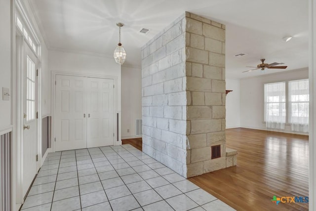 82 Bell Mountain Rd, Fredericksburg, TX 78675 - entryway with ceiling fan, light wood finished floors, and ornamental molding