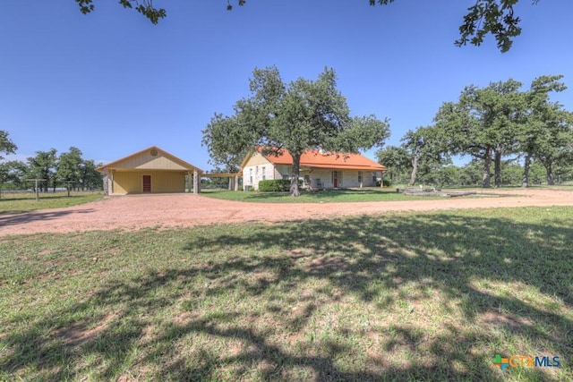 82 Bell Mountain Rd, Fredericksburg, TX 78675 - ranch-style home with driveway, a front yard, and an attached carport