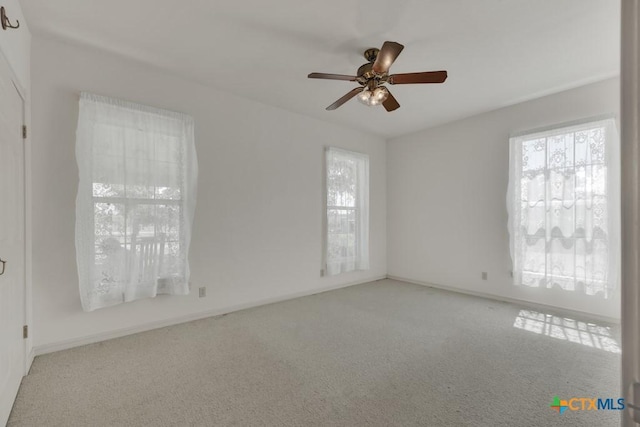82 Bell Mountain Rd, Fredericksburg, TX 78675 - carpeted spare room featuring plenty of natural light, ceiling fan, and baseboards