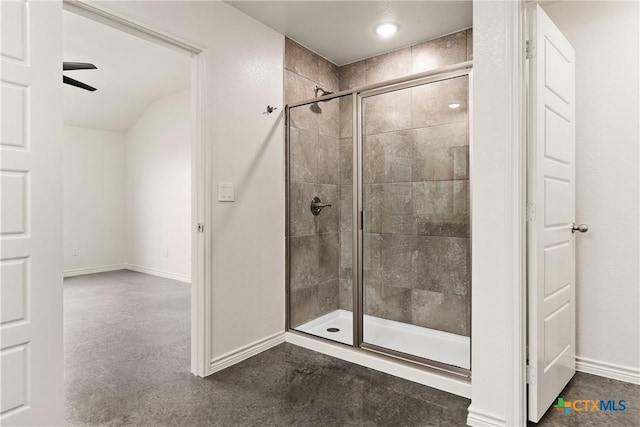 bathroom with lofted ceiling and a shower with shower door