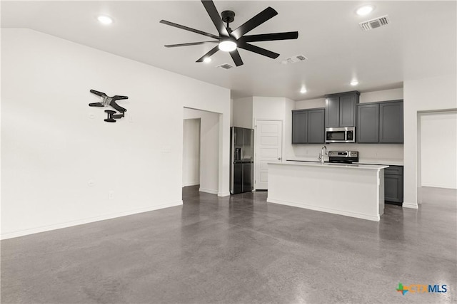 unfurnished living room featuring sink and ceiling fan