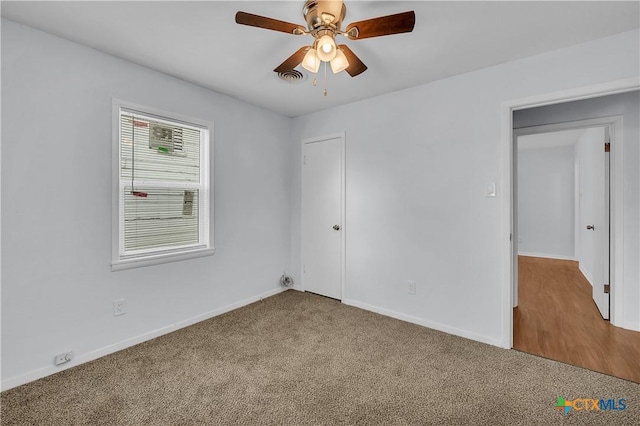 unfurnished room with carpet floors and ceiling fan