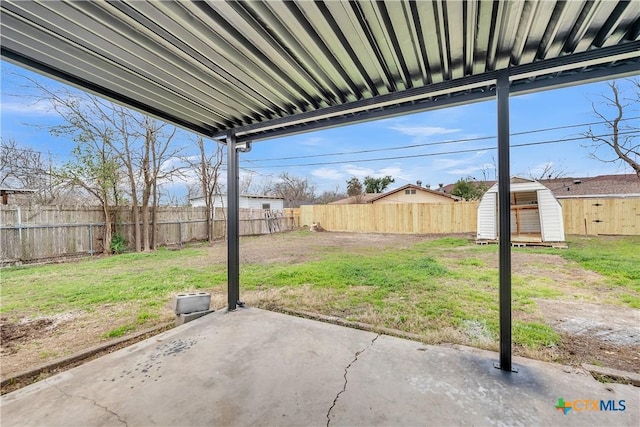 view of patio / terrace featuring a storage unit