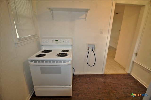 kitchen featuring white electric range oven, white cabinets, and dark wood-type flooring