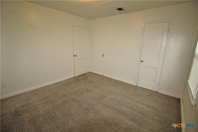 spare room with carpet floors