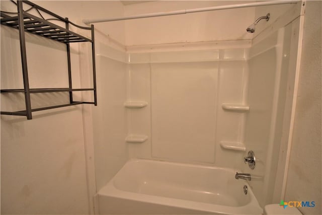 bathroom with bathing tub / shower combination