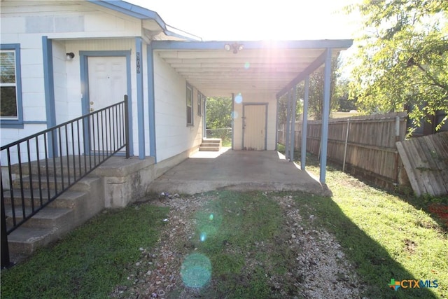 view of side of property with a carport