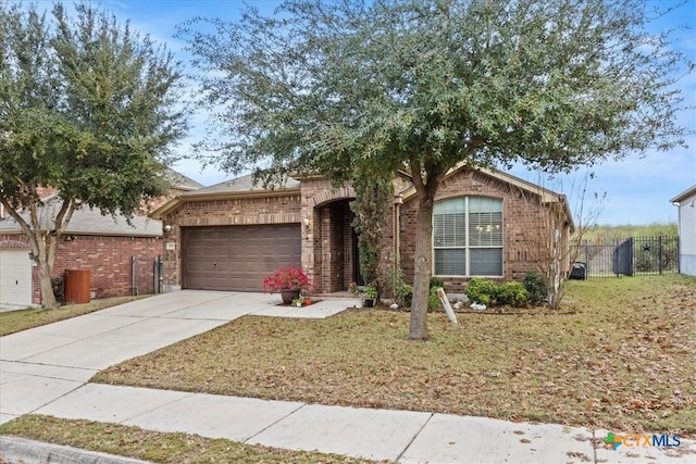 view of front of property with a front yard and a garage