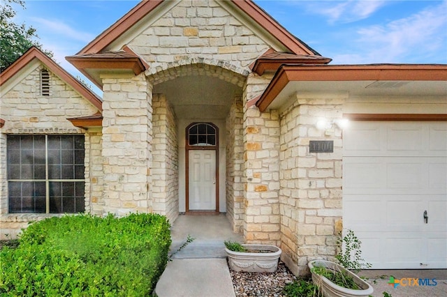 entrance to property featuring a garage