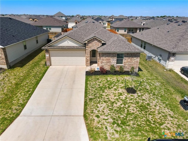 8508 Cantera Ridge Rd, Temple, TX 76502 - view of front of home with brick siding, cooling unit, driveway, roof with shingles, and an attached garage
