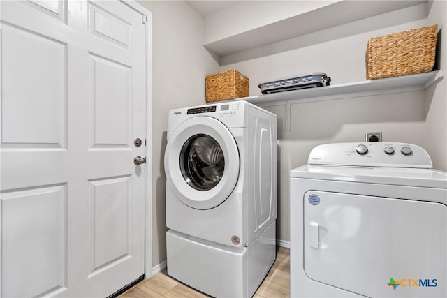 8508 Cantera Ridge Rd, Temple, TX 76502 - washroom with independent washer and dryer and light wood finished floors