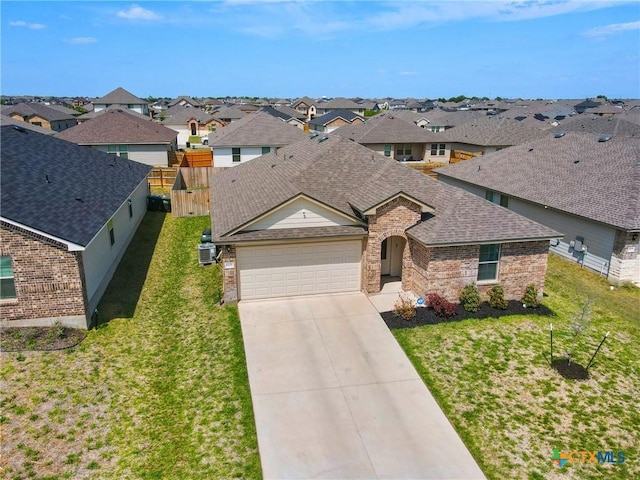 8508 Cantera Ridge Rd, Temple, TX 76502 - view of front of house featuring brick siding, roof with shingles, a residential view, and an attached garage