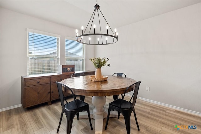 8508 Cantera Ridge Rd, Temple, TX 76502 - dining space with a chandelier, light wood-style flooring, and baseboards