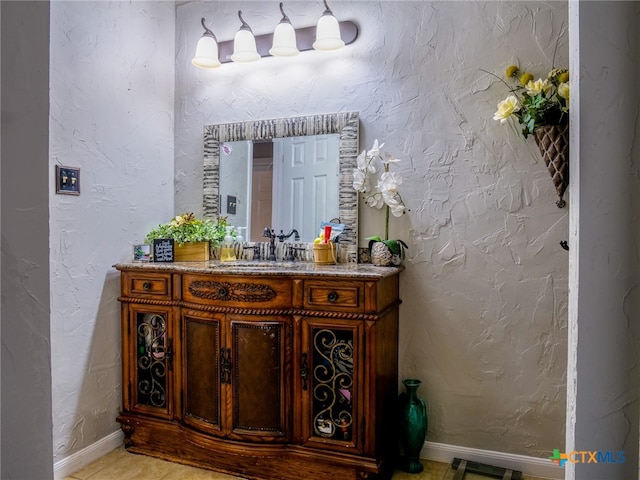 bathroom featuring vanity and tile patterned flooring