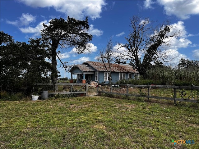 back of house featuring a gate