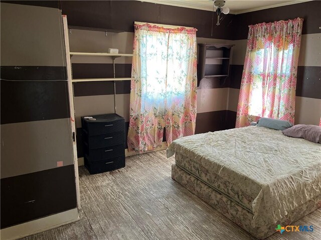 bedroom with wood finished floors
