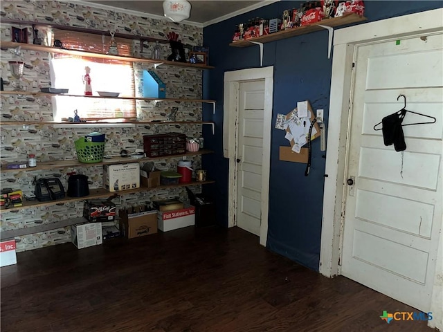interior space featuring crown molding and wood finished floors