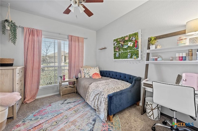 bedroom with ceiling fan and light carpet