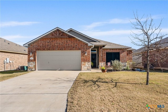 view of front of house with a front yard and a garage