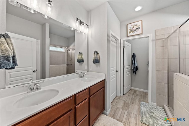 bathroom with vanity and an enclosed shower