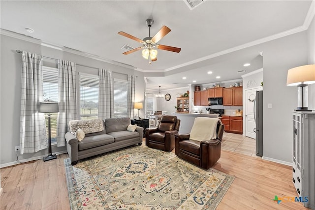 living room with ceiling fan, light hardwood / wood-style floors, and ornamental molding