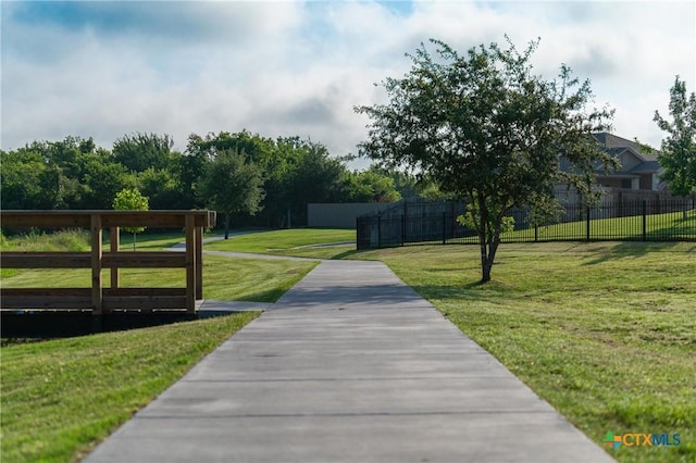 view of home's community featuring a lawn