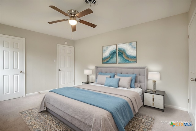 carpeted bedroom with ceiling fan, visible vents, and baseboards