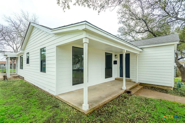 view of front of house with a shingled roof