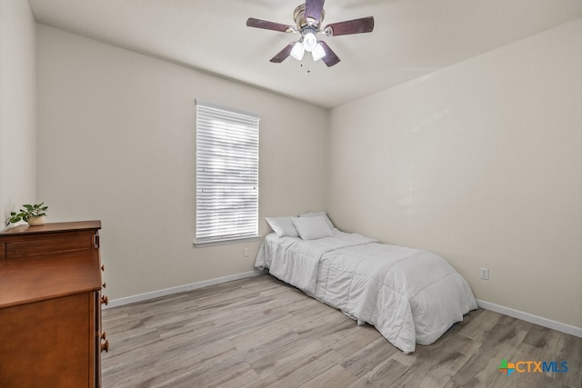 bedroom featuring light hardwood / wood-style floors and ceiling fan