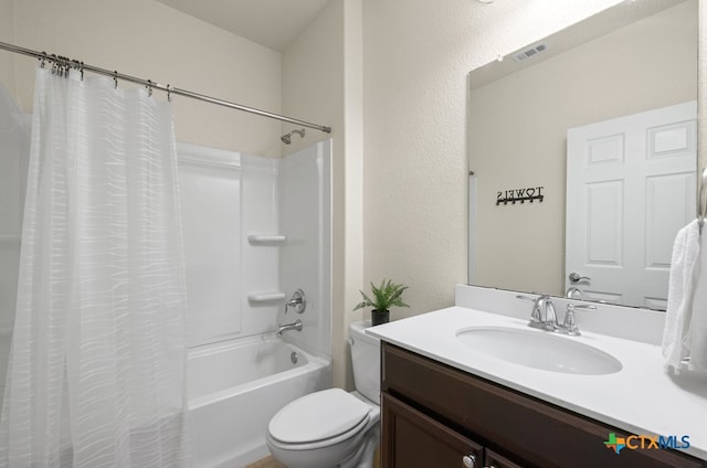 full bathroom featuring vanity, toilet, and shower / tub combo with curtain