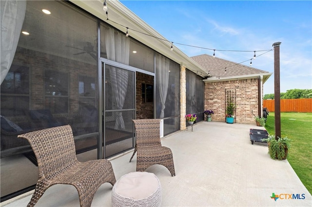 view of patio with a sunroom