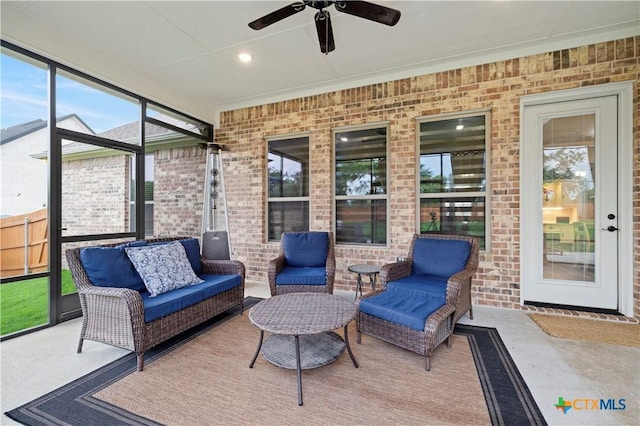 sunroom with ceiling fan