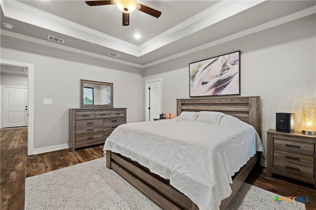 bedroom featuring ceiling fan, ornamental molding, a raised ceiling, and dark hardwood / wood-style floors