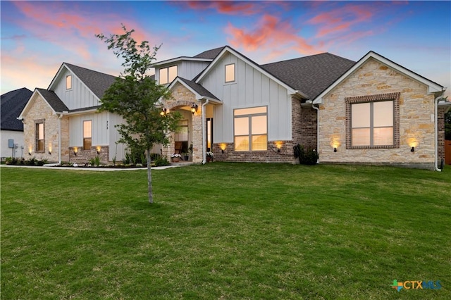 view of front of home with a yard