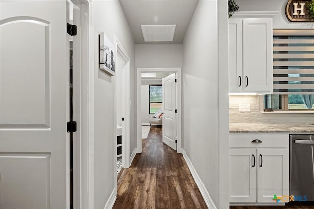 hallway with dark hardwood / wood-style floors