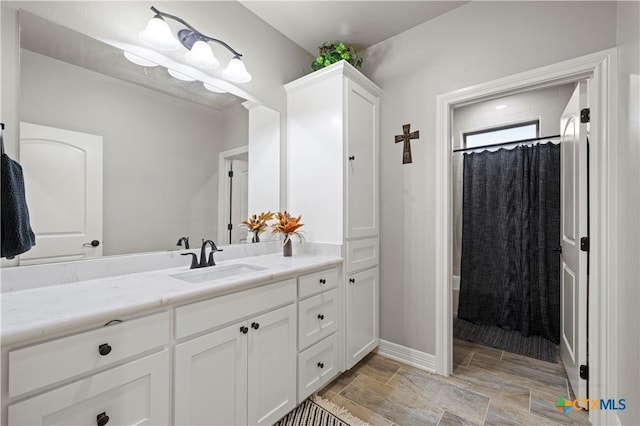 bathroom with vanity and a shower with curtain