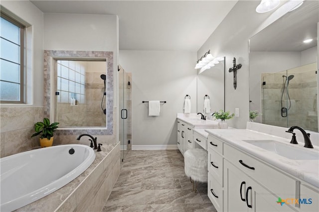 bathroom featuring shower with separate bathtub and vanity