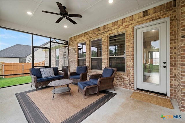 sunroom / solarium with ceiling fan