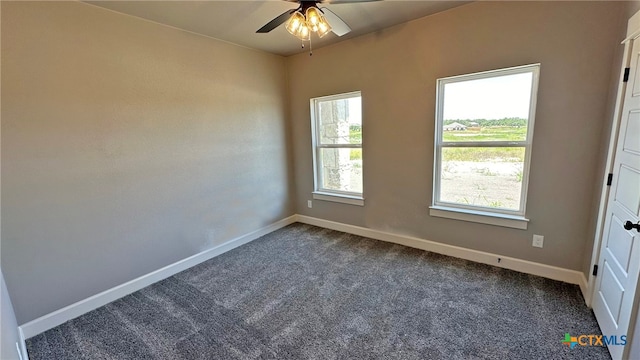 carpeted spare room with ceiling fan